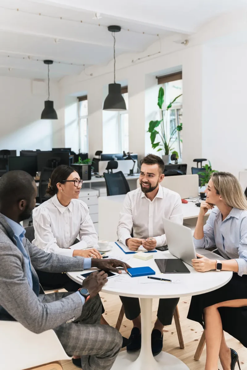 group of professionals talking around a table