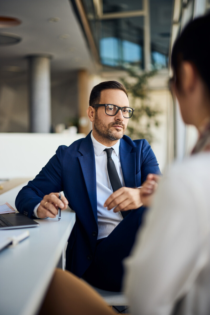 Professional Business Discussion Between Colleagues in a Modern Office Setting